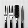 Variety of grilling tools including spatulas, tongs, and brushes