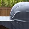 Heavy-duty grill cover protecting a barbecue from elements